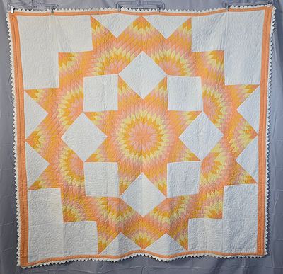 Vintage c1930 Broken Star Quilt Measuring 75 by 75 inches. Cheery color palette with peach 