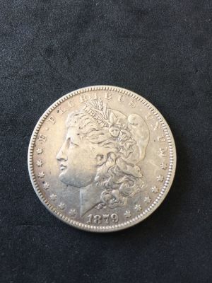 מטבע כסף - מורגן 1 דולר 1879, ארצות הברית, מצב מעולה. 
משקל: כ- 26.7 גרם, טוהר: 0.900, קוטר: 37 מ"מ.