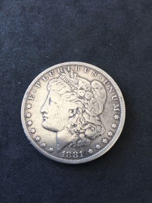 מטבע כסף - מורגן 1 דולר 1881, ארצות הברית, מצב מעולה. 
משקל: כ- 26.7 גרם, טוהר: 0.900, קוטר: 37 מ"מ.
