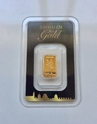 מטיל זהב טהור 999.9 באריזה מקורית. 1 גרם. 
מספר סידורי: 06815 
FINE GOLD BAR 
