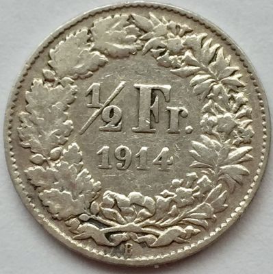 מטבע חצי פרנק מכסף, שווייץ שנת 1914. 
כסף 0.835, משקל 2.5 גר', קוטר 18.2 מ"מ.