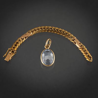 Colgante de topacio color azul y fragmento de pulsera en oro amarillo de 18kt