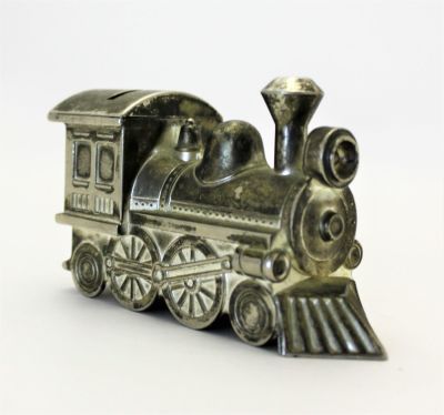 Копилка в виде паровоза 1970 г. 
Длина 14 см., высота 8.5 см.