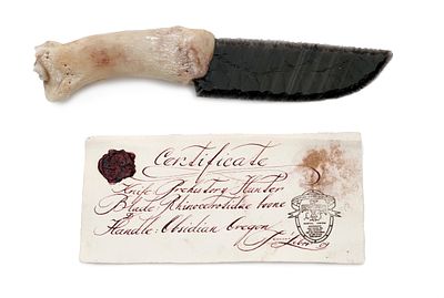 Knife of Prehistoric Hunter by Libor Tobol&aacute;k. Cipped blade of obsidian, handle of rhinoceros 