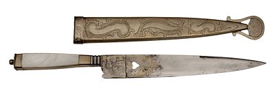 Luxury hunting dagger. Straight single edged blade with a central point and a short false edge 