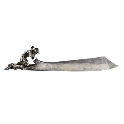KARL FABERG&Eacute; - SILVER LETTER OPENER WITH A PEASANT FIGURE, KARL FABERG&Eacute; FIRM, MOSCOW, 1880s. SILVER 