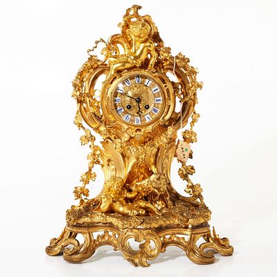 Mantel clock in Louis XV style. Mantel clock in gilded bronze in Louis XV style, richly 