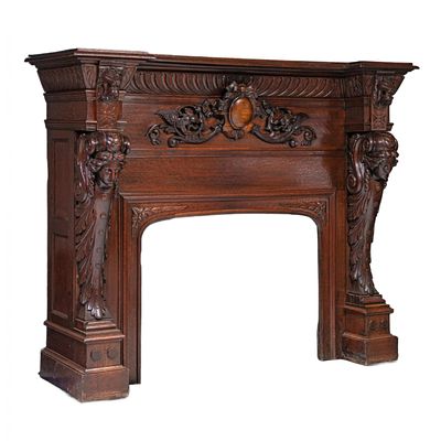 Carved oak fireplace in Renaissance style. Carved oak fireplace with noble stained color and 