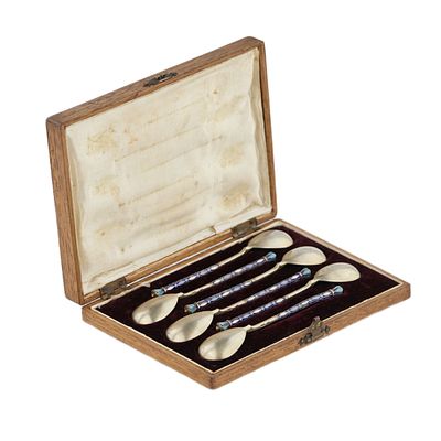 A set of teaspoons decorated with enamel in the original case. Moscow 1908-1917. A set of 