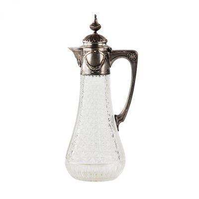 Crystal jug with silver. Early 20th century. Crystal jug with silver, in a neo-classical 