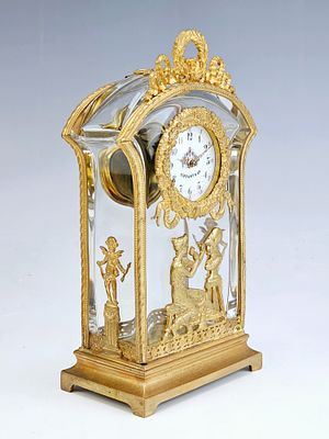 ANTIQUE FRENCH EMPIRE BRONZE CRYSTAL CLOCK BY TIFFANY. A fine antique French Empire gilt bronze 