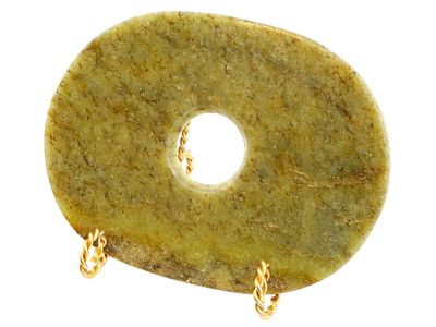 ANTIQUE CHINESE CARVED JADE STONE BI DISC AMULET. An antique Chinese hand carved jade stone bi 