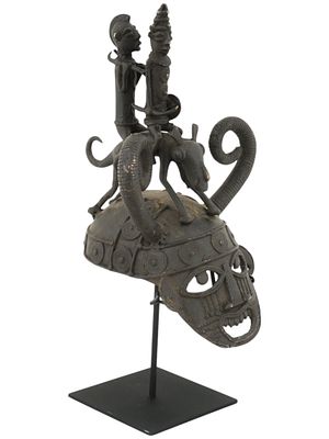 WEST AFRICA BENIN CAST BRONZE HELMET MASK. A cast bronze helmet mask from Benin, Nigeria, West