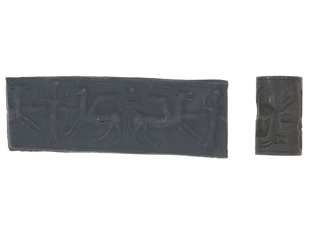 BABYLONIAN CYLINDER HEMATITE SEAL ENGRAVED BEAD. An ancient Babylonian carved hematite stone 