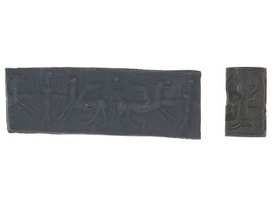 BABYLONIAN CYLINDER HEMATITE SEAL ENGRAVED BEAD. An ancient Babylonian carved hematite stone