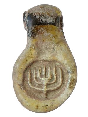 ANCIENT ROMAN GLASS AMULET MENORAH CIRCA 100 AD. An ancient gold tone glass pendant adorned