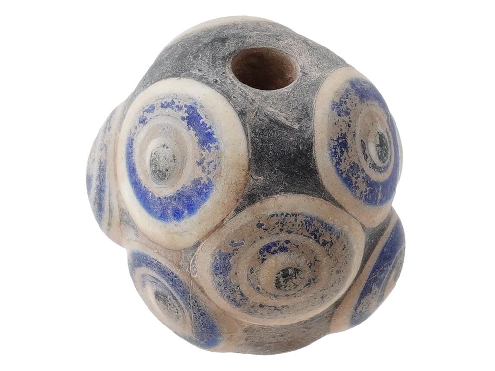 ANCIENT PHOENICIAN RAISED EYES FUSED GLASS BEAD. An ancient Phoenician Raised Eyes fused glass 
