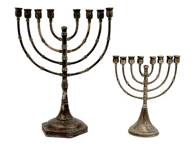 TWO ANTIQUE STERLING SILVER MENORAH LAMPS. A lot of two antique sterling silver menorah lamps