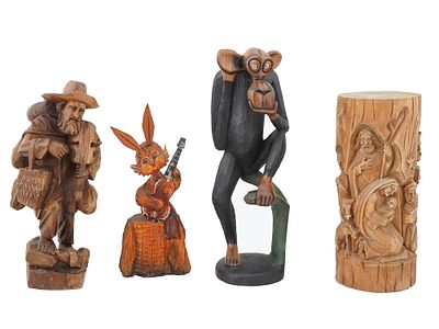 VINTAGE CARVED WOODEN FIGURINES. A group of four vintage carved wooden pieces, including a 