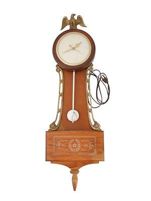 UNITED CLOCK CORP WOODEN BANJO WALL CLOCK. An electrical wall clock by United Clock Corp., an 