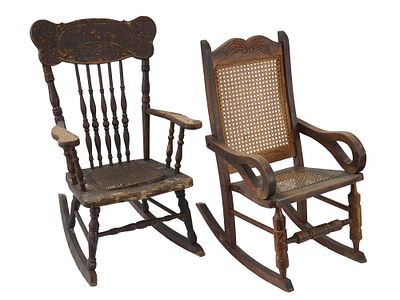 ANTIQUE CHILDRENS ROCKING CHAIRS CARVED WOOD CANEWORK. A pair of antique childrens rocking 