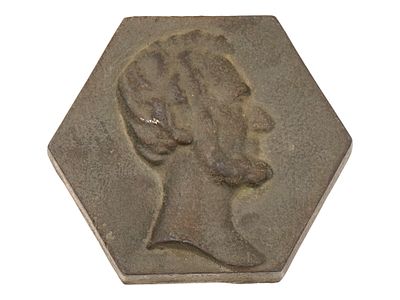 ANTIQUE AMERICAN CAST IRON LINCOLN PAPERWEIGHT. An antique American cast iron Lincoln 