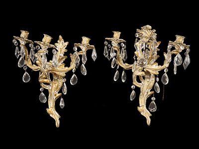 PAIR OF VINTAGE BRASS AND CRYSTAL WALL SCONCES. A pair of vintage brass three-light wall 