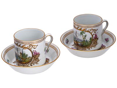 PAIR OF RUSSIAN STYLE PORCELAIN CUPS AND SAUCERS. A pair of matching Russian white porcelain tea 