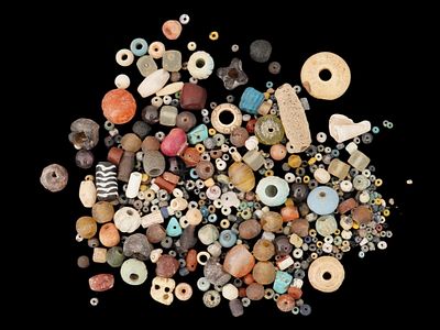 LOT OF ANCIENT MEDITERRANEAN GLASS AND FAIENCE BEADS. A large group of Ancient Roman or Greek 