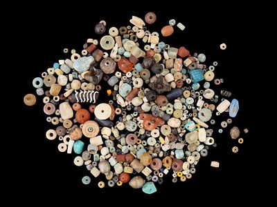 LOT OF ANCIENT MEDITERRANEAN GLASS AND FAIENCE BEADS. A large group of Ancient Roman or Greek 