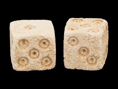 PAIR OF ANCIENT ROMAN CARVED STONE DICE 100 TO 300 AD. A pair of ancient Roman carved stone dice 