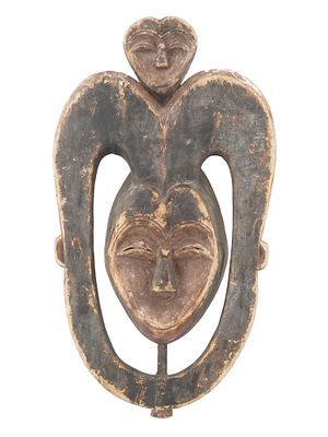 AFRICAN CARVED WOODEN KWELE FACE MASK FROM GABON. A Central African hand carved wooden face mask 