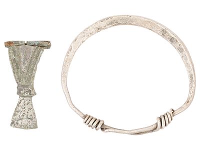 ANCIENT GREEK ENGRAVED FIBULA AND SILVER BRACELET. A lot of two Ancient Greek items, including 