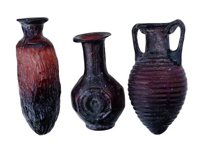 GROUP OF THREE ANCIENT ROMAN GLASS PERFUME BOTTLES. A group of three ancient Roman glass perfume 