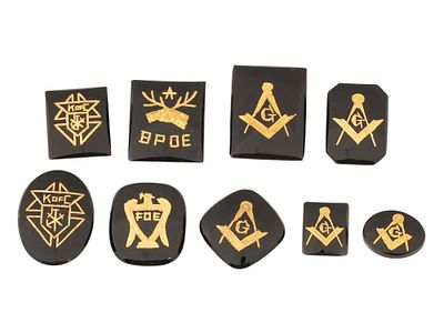 COLLECTION OF GILDED AND CARVED STONE INTAGLIOS. A collection of nine hand carved stone 