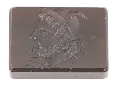 BROWN ONYX INTAGLIO WITH PROFILE OF POSEIDON. An onyx intaglio engraved with the profile of 