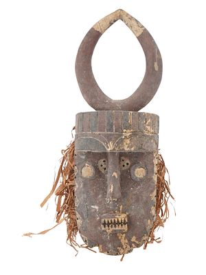 WEST AFRICAN IVORY COAST GREBO WOOD HUNTING MASK. A West African hand carved and painted wooden 