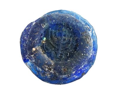 ANCIENT ROMAN COBALT BLUE GLASS MEDALLION W MENORAH. An ancient Roman cobalt blue glass 