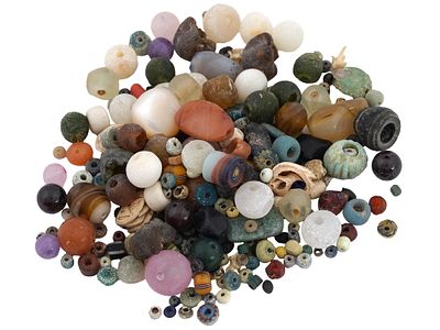 ANCIENT AMETHYST CORNELIAN AGATE GARNET GLASS BEADS. A large collection of various ancient beads 