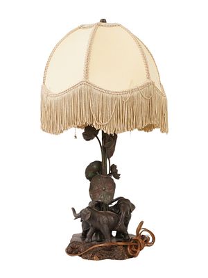ANTIQUE BRONZE TABLE LAMP WITH ELEPHANT FIGURES. An antique bronze table lamp with elephant 