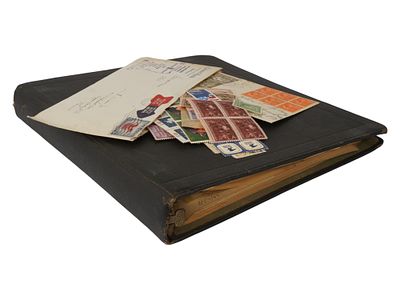 VINTAGE POSTAGE STAMP ALBUM WITH INTERNATIONAL STAMPS. A vintage postage stamp album containing 