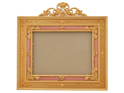 FRENCH BRONZE AND ENAMEL ORMOLU PICTURE FRAME. A French gilt bronze desk picture frame. The 