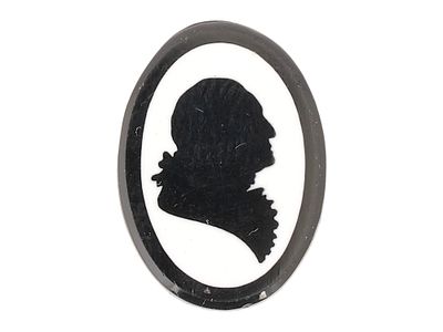 SILHOUETTE OF GEORGE WASHINGTON CARVED STONE CAMEO. An Art Deco manner oval shaped carved stone 