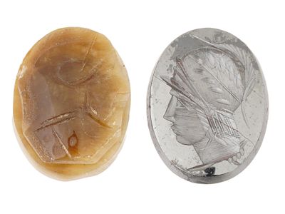 PAIR OF VINTAGE HAND CARVED STONE CAMEOS. A pair of vintage hand-carved oval cameos. Amber cameo 