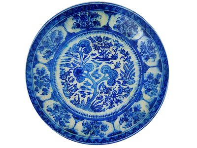 PERSIAN QAJAR DYNASTY BLUE AND WHITE CERAMIC PLATE. An antique Persian Qajar Dynasty blue and 