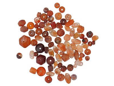 ANCIENT EGYPTIAN CARNELIAN BEADS 1000BC TO 100AD. A collection of Egyptian carnelian beads 