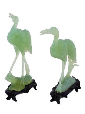 PAIR OF CHINESE CARVED JADE CRANE FIGURES IN BOX. A pair of Chinese hand carved figurines made 