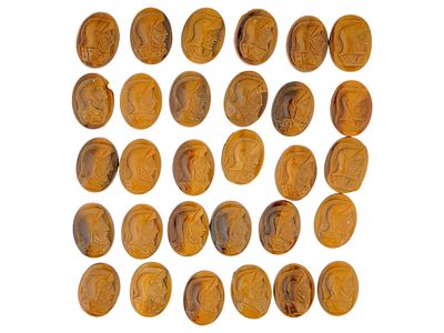 COLLECTION OF PORTRAIT CARVED TIGERS EYE STONE CAMEOS. A collection of 30 hand carved stone 