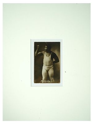 ANTIQUE RUSSIAN PORTRAIT PHOTO OF TUNISIAN WRESTLER. An antique Russian post card with a black 