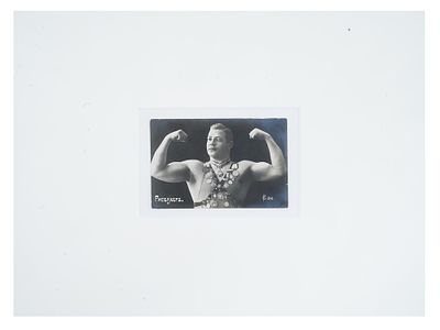 ANTIQUE RUSSIAN PORTRAIT PHOTO OF AUSTRIAN WRESTLER. An antique Russian post card with a black 